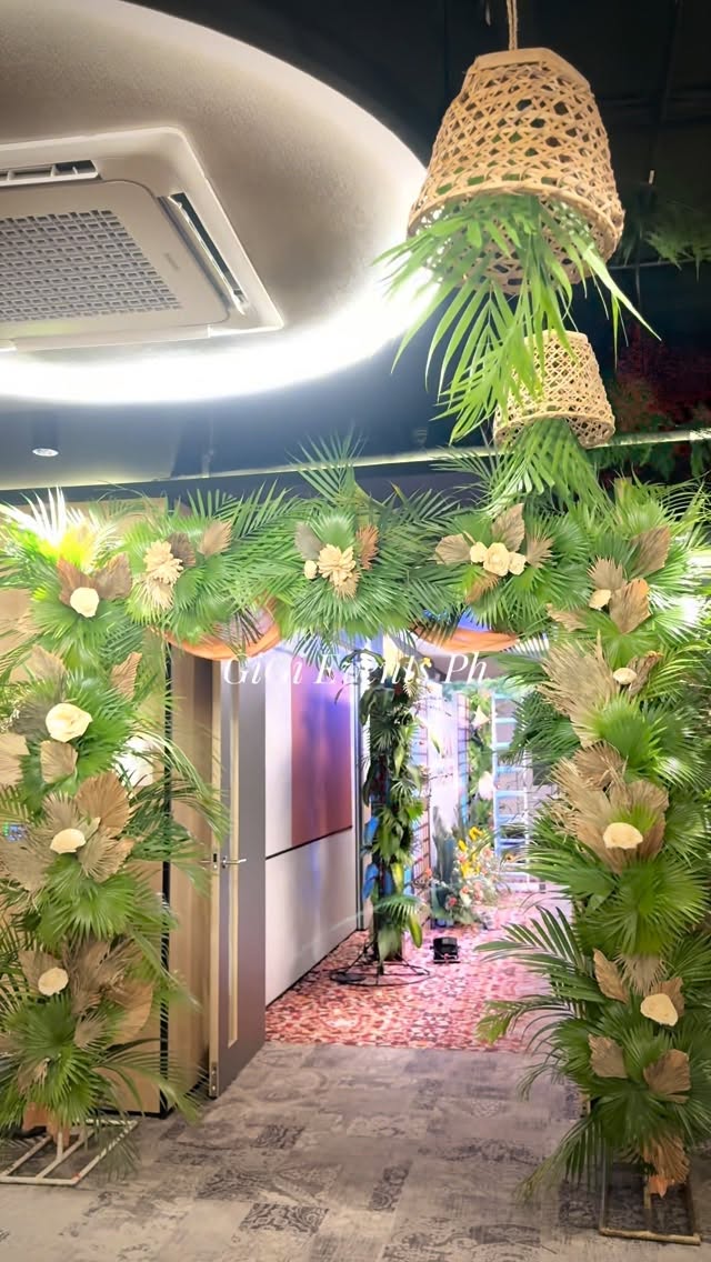 Tropical floral entrance arch by GiGi Events Ph